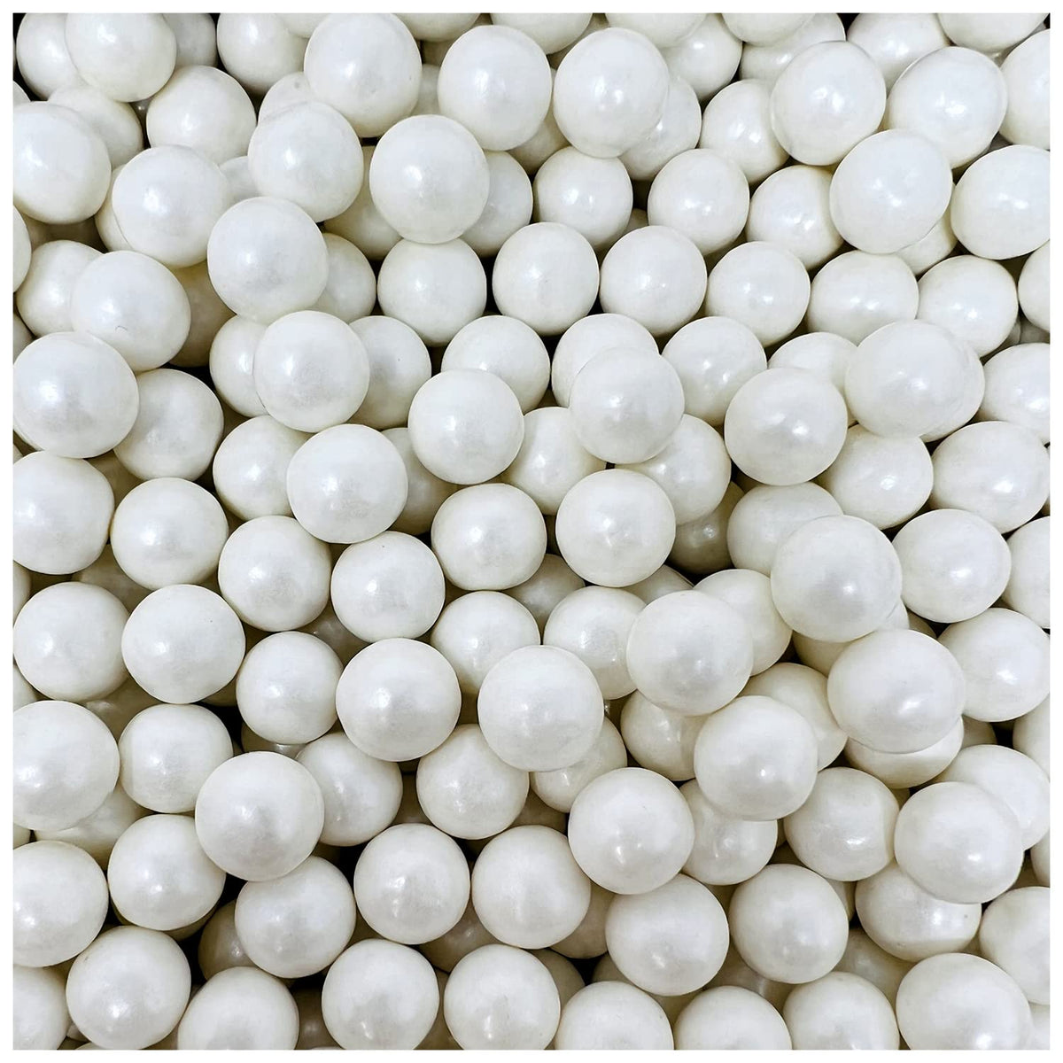 A dense pile of small, glossy white gumballs filling the frame.