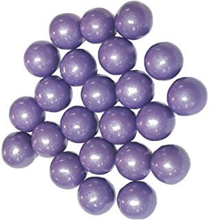 A pile of glossy, purple gumballs with a pearlescent finish, arranged on a plain white background.